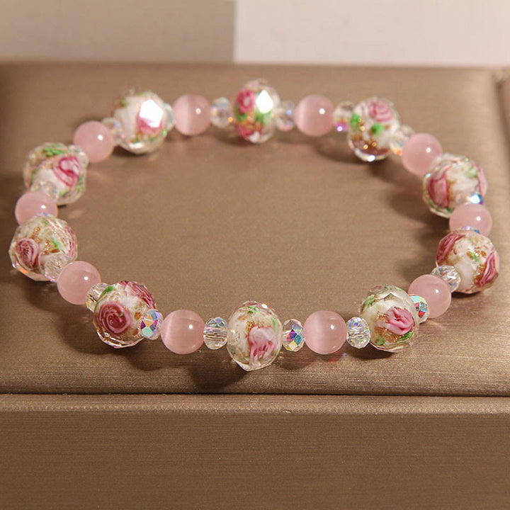Pulsera cálida de ojo de gato con cuentas de cristal rosa Liuli y Buddha Stones
