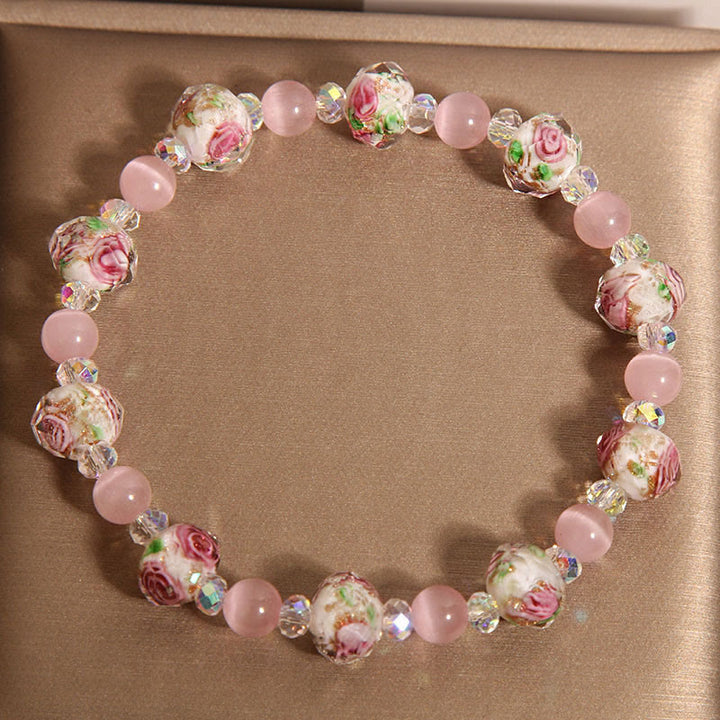 Pulsera cálida de ojo de gato con cuentas de cristal rosa Liuli y Buddha Stones