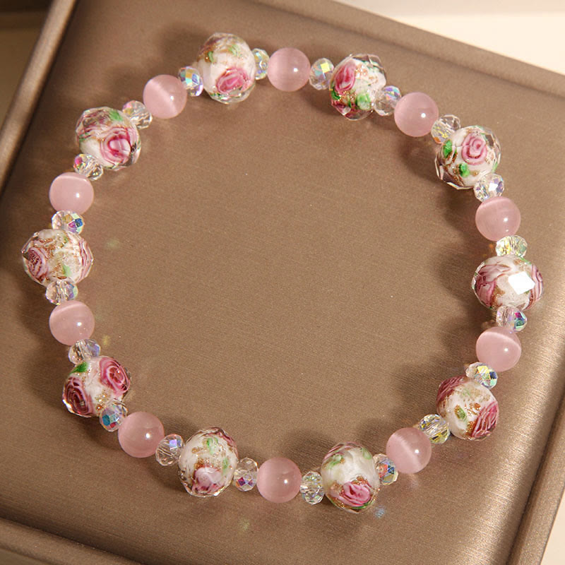 Pulsera cálida de ojo de gato con cuentas de cristal rosa Liuli y Buddha Stones
