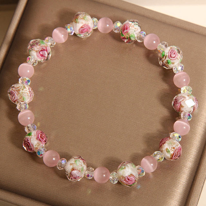 Pulsera cálida de ojo de gato con cuentas de cristal rosa Liuli y Buddha Stones