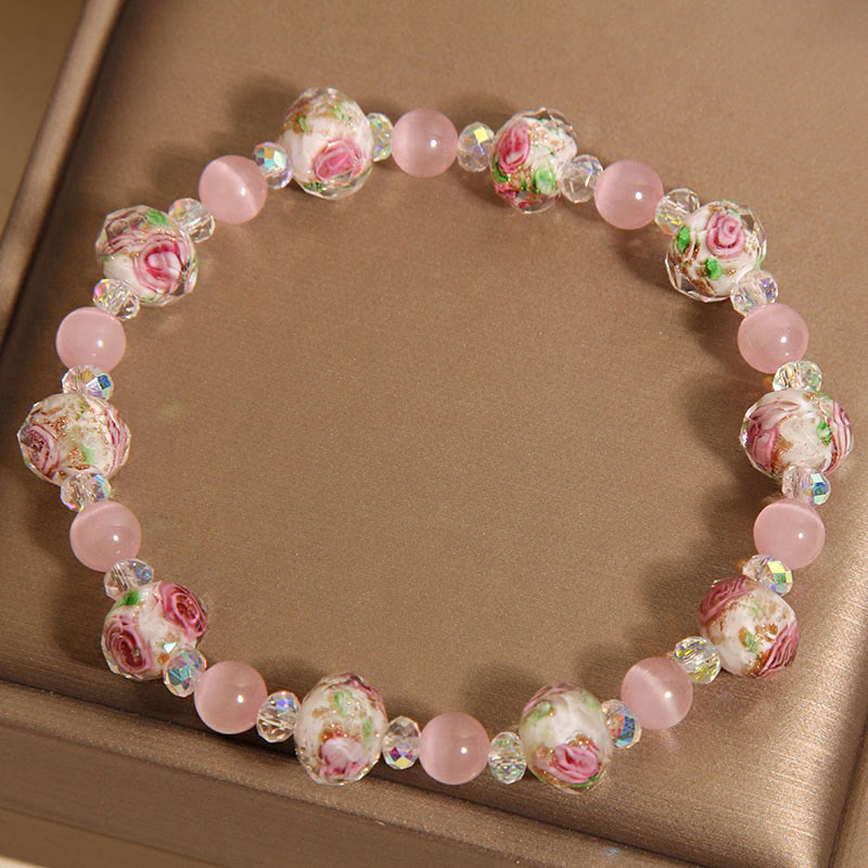 Pulsera cálida de ojo de gato con cuentas de cristal rosa Liuli y Buddha Stones