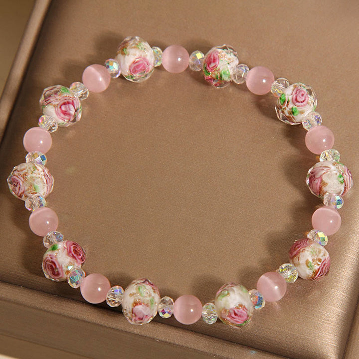 Pulsera cálida de ojo de gato con cuentas de cristal rosa Liuli y Buddha Stones