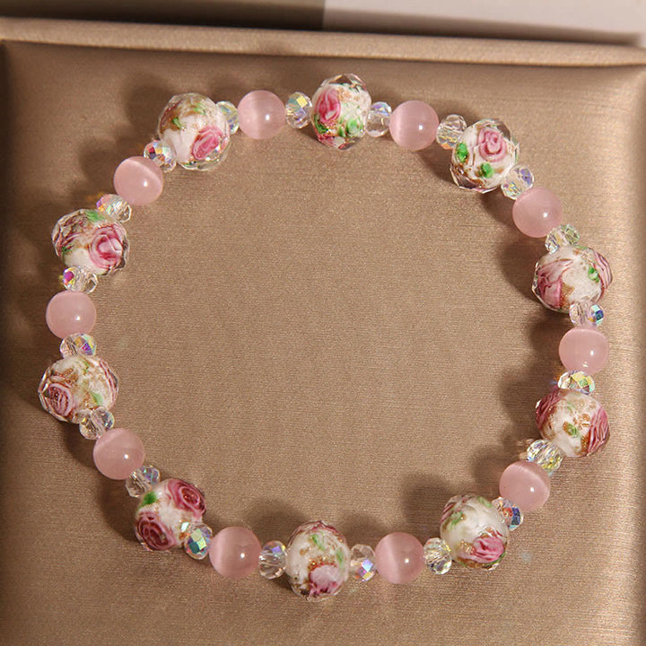 Pulsera cálida de ojo de gato con cuentas de cristal rosa Liuli y Buddha Stones
