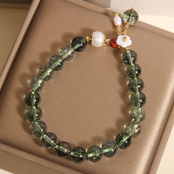 Pulsera positiva con flor de concha de perla fantasma verde natural de Buddha Stones