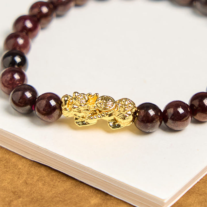 Pulsera de protección PiXiu con cuentas de granate natural y Buddha Stones