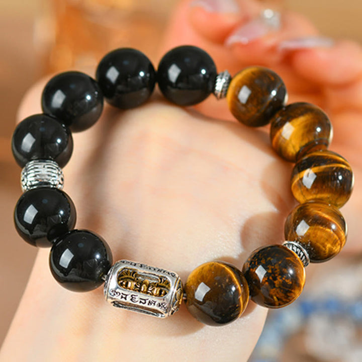 Pulsera protectora Vajra de obsidiana y ojo de tigre con brillo plateado natural de Buddha Stones