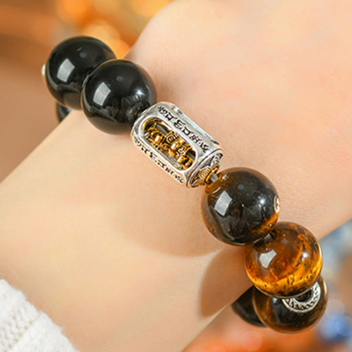 Pulsera protectora Vajra de obsidiana y ojo de tigre con brillo plateado natural de Buddha Stones
