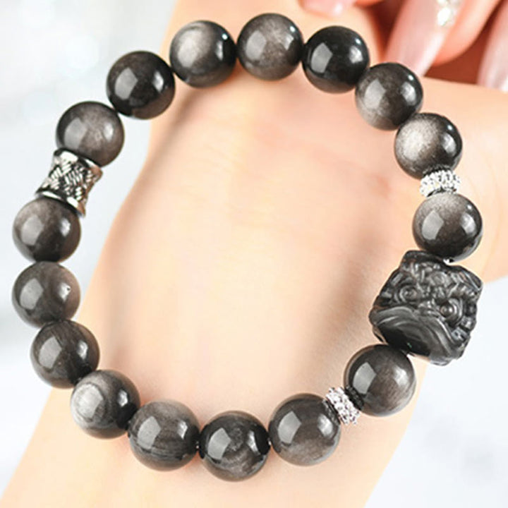 Pulsera protectora de obsidiana con brillo de plata natural y Buddha Stones para danza del león