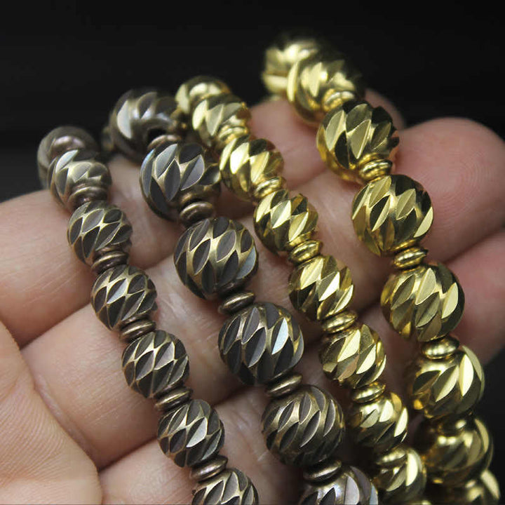Pulsera de riqueza con cuentas de cobre y latón, con diseño de cuchillo tallado envejecido y Buddha Stones
