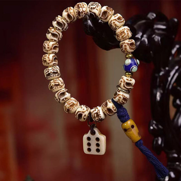Pulsera de borlas protectoras talladas con garuda de hueso de camello tibetano y Buddha Stones