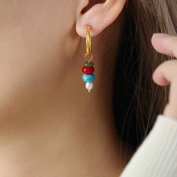 Pendientes de acero y titanio con diseño de piedra marnyi tibetana de Buddha Stones y ágata roja natural.