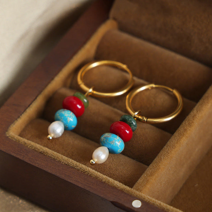 Pendientes de acero y titanio con diseño de piedra marnyi tibetana de Buddha Stones y ágata roja natural.