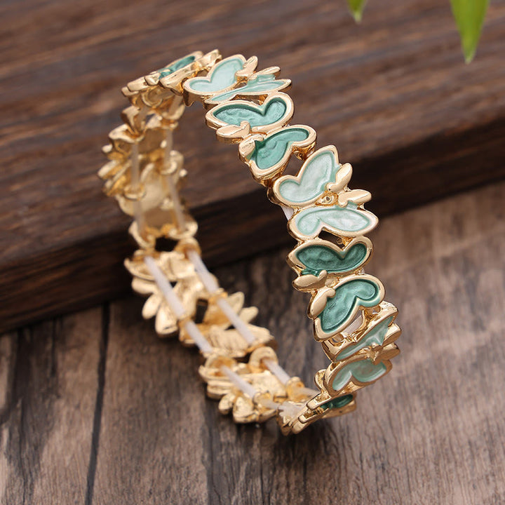 Pulsera elástica de aleación con diseño de mariposas coloridas y Buddha Stones