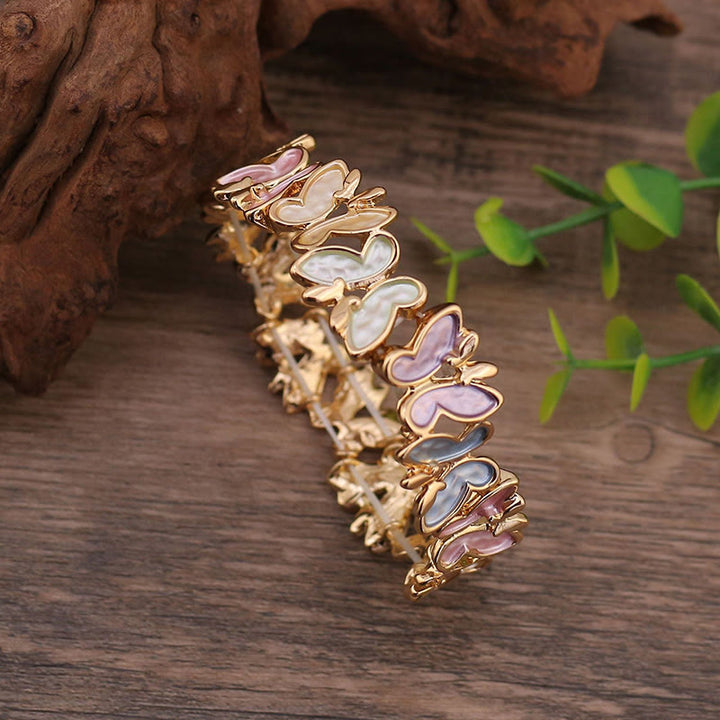 Pulsera elástica de aleación con diseño de mariposas coloridas y Buddha Stones