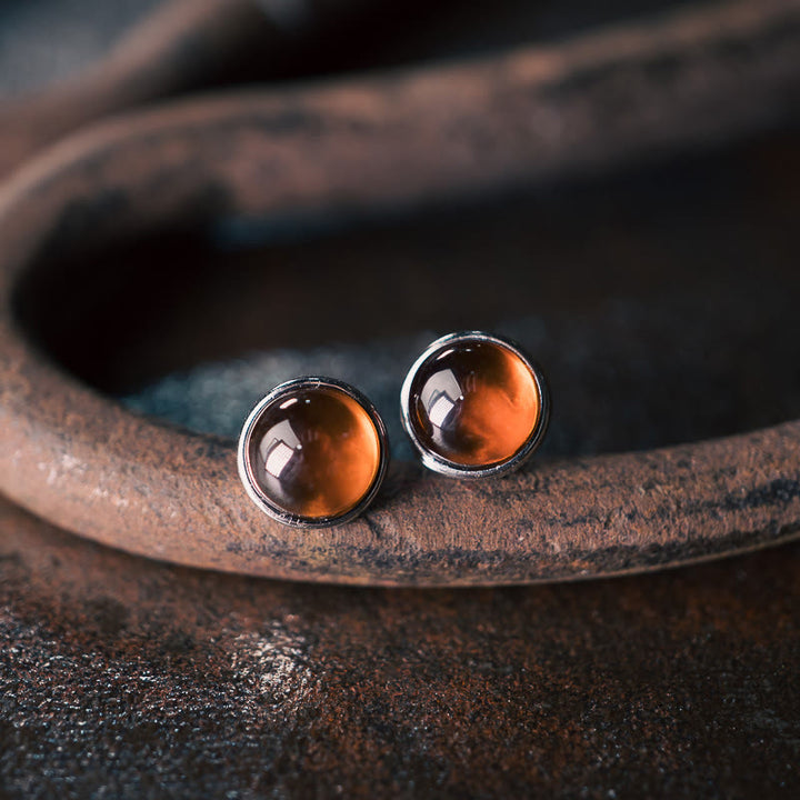 Pendientes de protección con granate y Buddha Stones en plata de ley 925