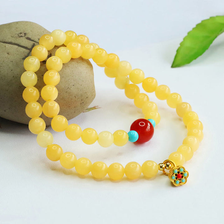 Pulsera de la fortuna con cuentas de ágata roja y topacio de Buddha Stones