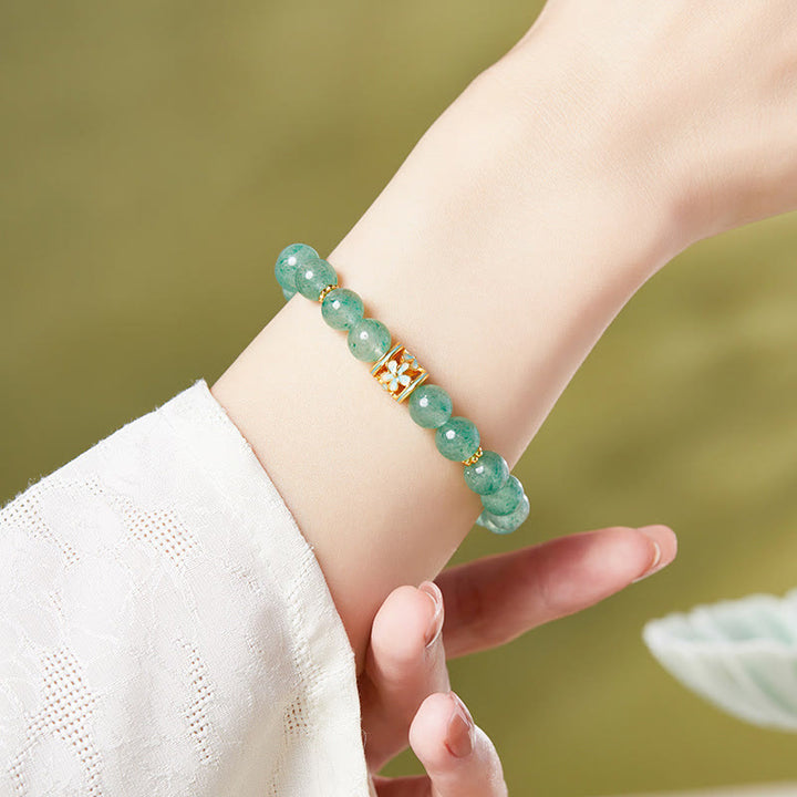Pulsera Buddha Stones de plata de ley 925 con cuarzo fresa verde y flor de la calma
