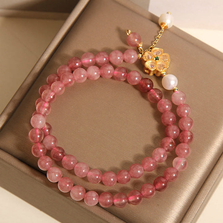 Pulsera positiva con diseño de trébol de cuatro hojas y cuarzo fresa de Buddha Stones
