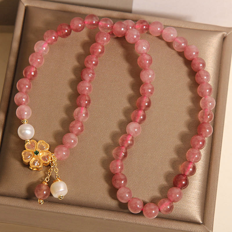 Pulsera positiva con diseño de trébol de cuatro hojas y cuarzo fresa de Buddha Stones