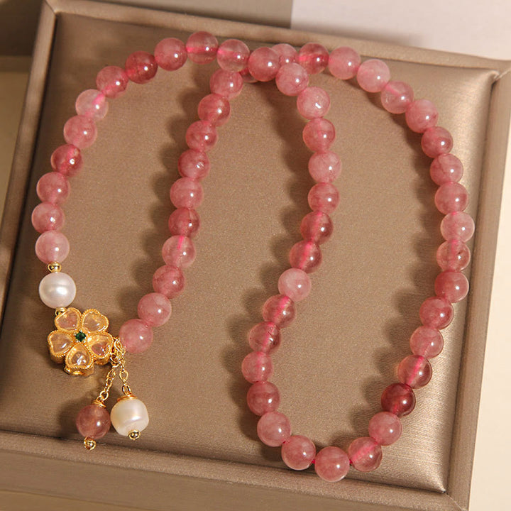 Pulsera positiva con diseño de trébol de cuatro hojas y cuarzo fresa de Buddha Stones