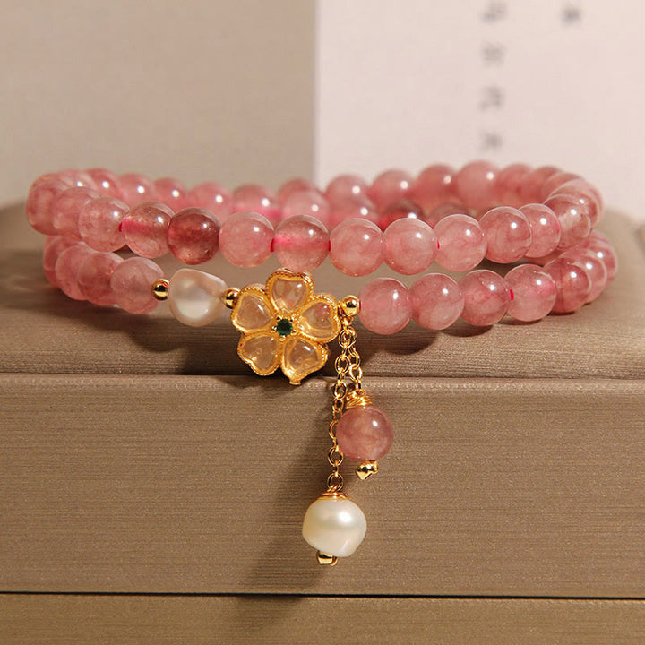 Pulsera positiva con diseño de trébol de cuatro hojas y cuarzo fresa de Buddha Stones