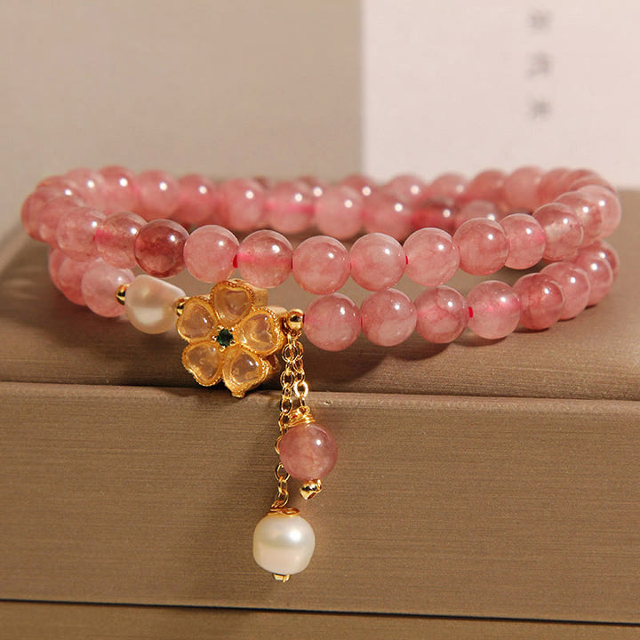 Pulsera positiva con diseño de trébol de cuatro hojas y cuarzo fresa de Buddha Stones