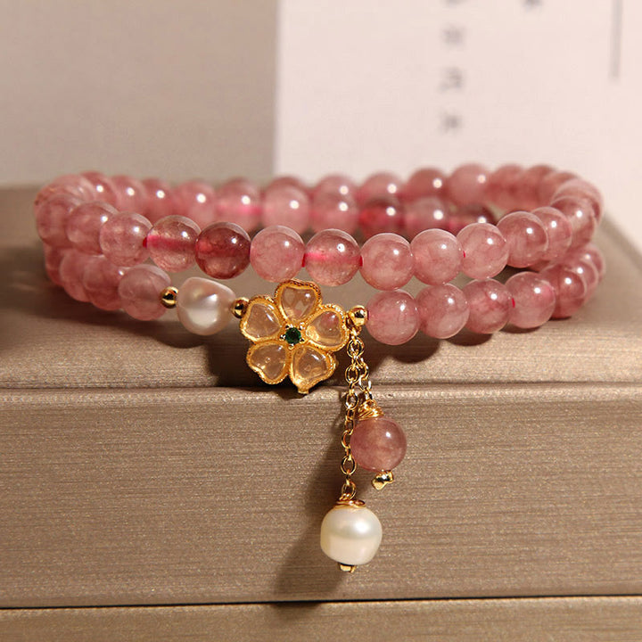 Pulsera positiva con diseño de trébol de cuatro hojas y cuarzo fresa de Buddha Stones