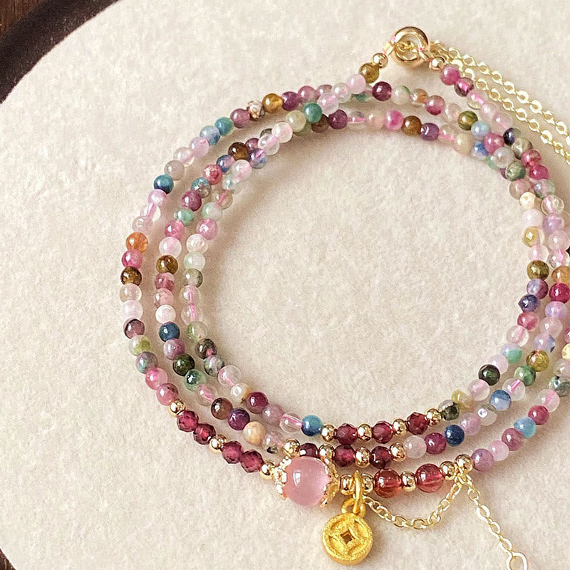 Pulsera de la sabiduría con monedas de turmalina de colores y cuentas irregulares de 2,5 mm de Buddha Stones