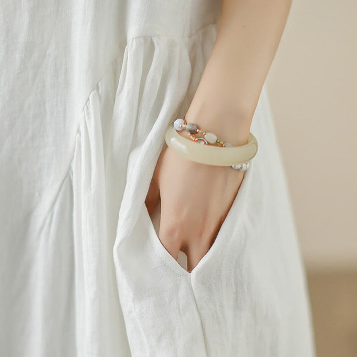 Vestido midi de algodón sin mangas con diseño informal de Buddha Stones , estampado floral blanco, botones en la espalda y bolsillos - image 8