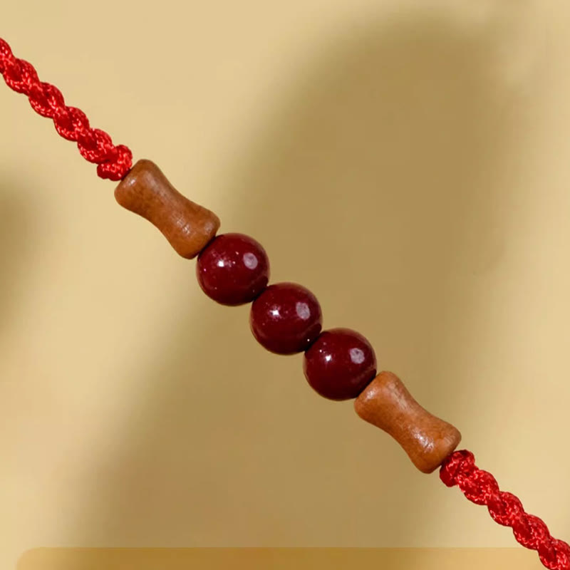 Pulsera de hilo bendecido de madera de melocotón con cuentas de cinabrio y Buddha Stones