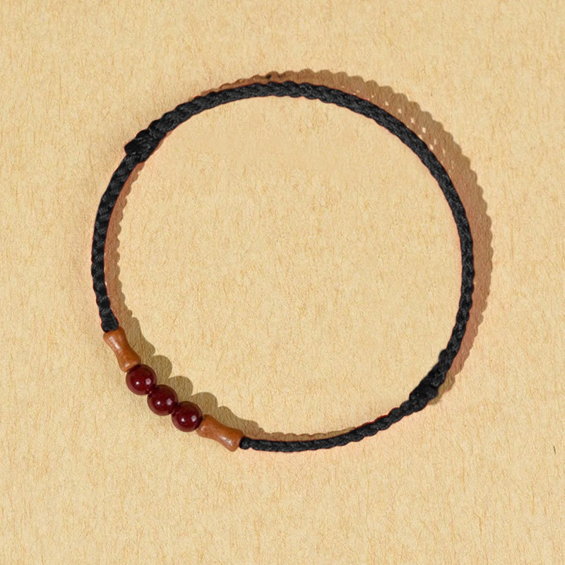 Pulsera de hilo bendecido de madera de melocotón con cuentas de cinabrio y Buddha Stones