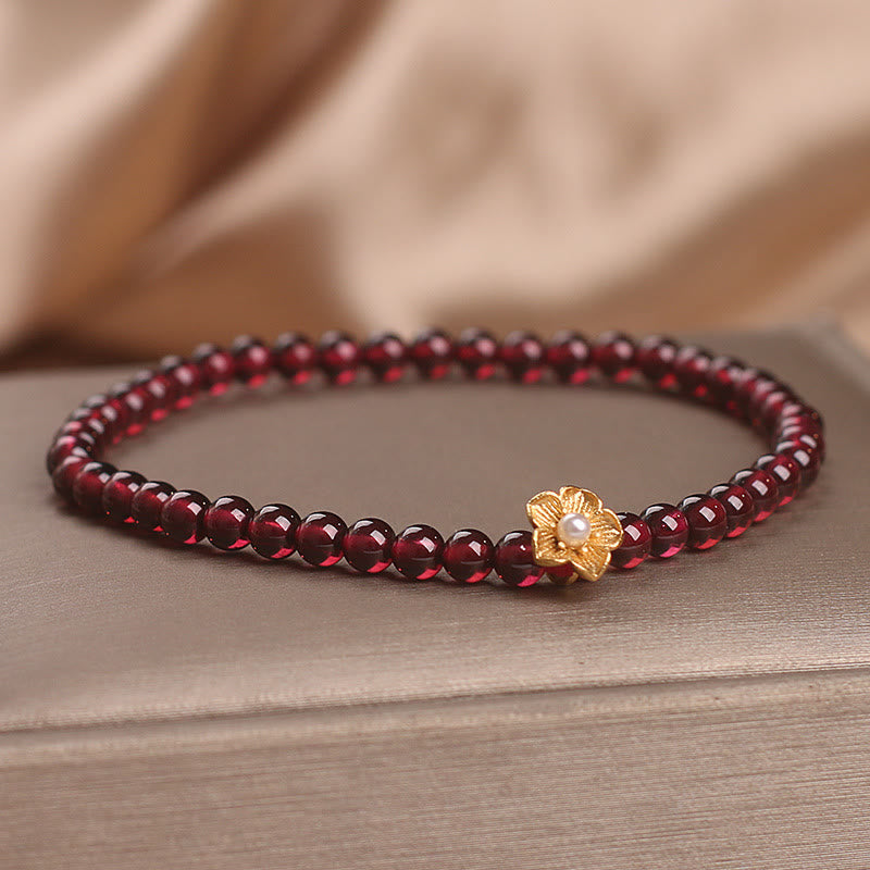 Pulsera de granate natural de 4 mm con Buddha Stones y flor de la pasión