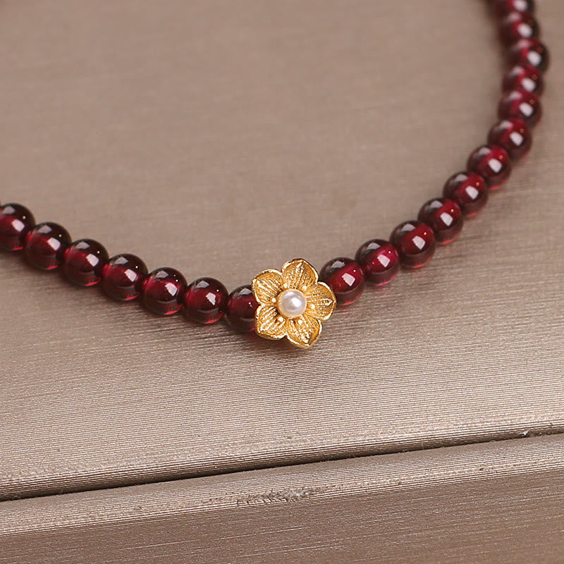 Pulsera de granate natural de 4 mm con Buddha Stones y flor de la pasión