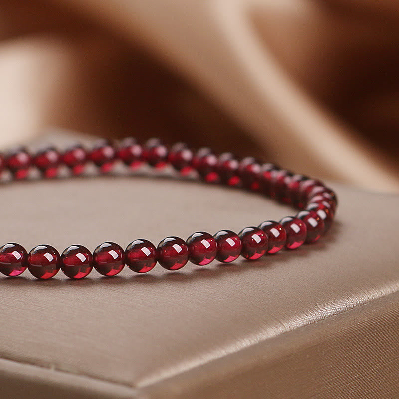 Pulsera de granate natural de 4 mm con Buddha Stones y flor de la pasión
