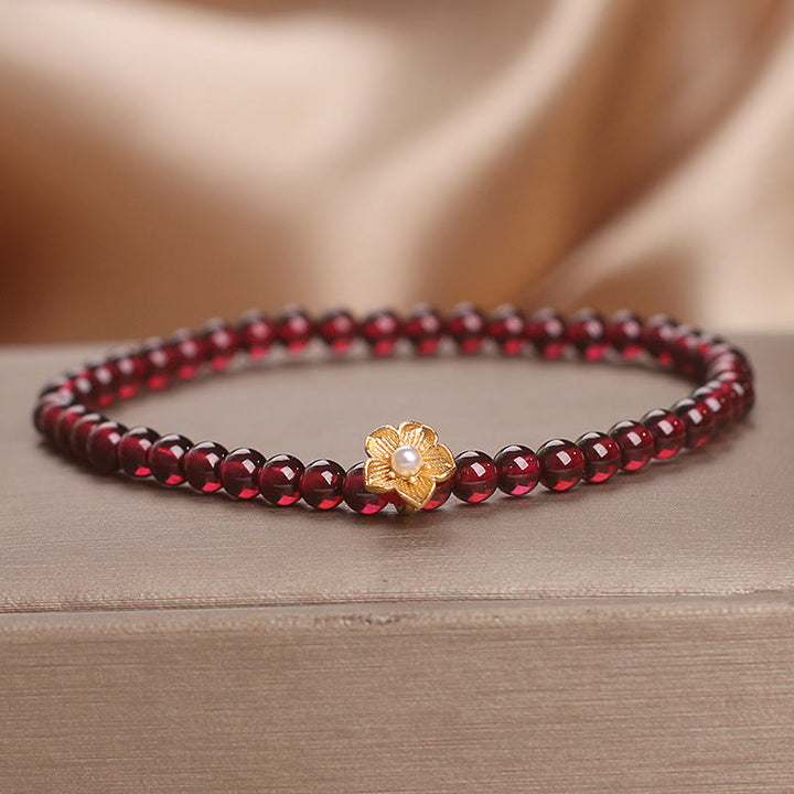 Pulsera de granate natural de 4 mm con Buddha Stones y flor de la pasión