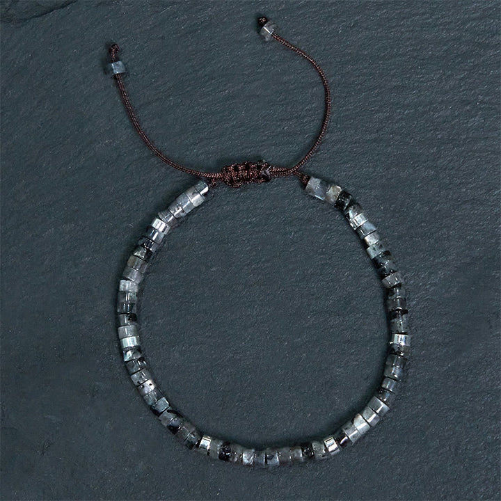 Pulsera de cuentas espaciadoras con coraje y piedras naturales negras brillantes de Buddha Stones