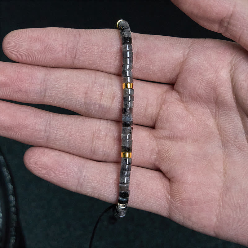 Pulsera de cuentas espaciadoras con coraje y piedras naturales negras brillantes de Buddha Stones