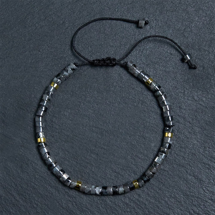 Pulsera de cuentas espaciadoras con coraje y piedras naturales negras brillantes de Buddha Stones