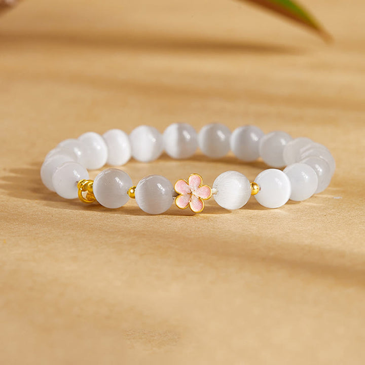 Pulsera con Buddha Stones en plata de ley 925 con ojo de gato blanco y flor de melocotón natural
