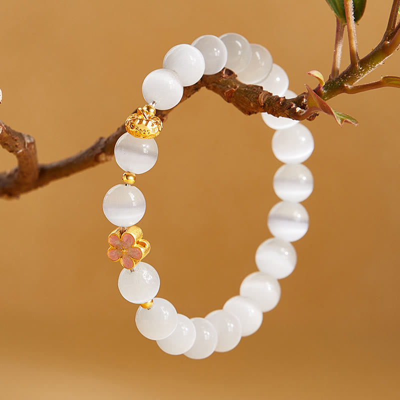 Pulsera con Buddha Stones en plata de ley 925 con ojo de gato blanco y flor de melocotón natural