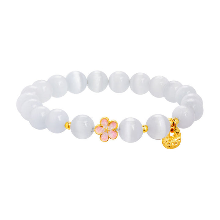 Pulsera con Buddha Stones en plata de ley 925 con ojo de gato blanco y flor de melocotón natural