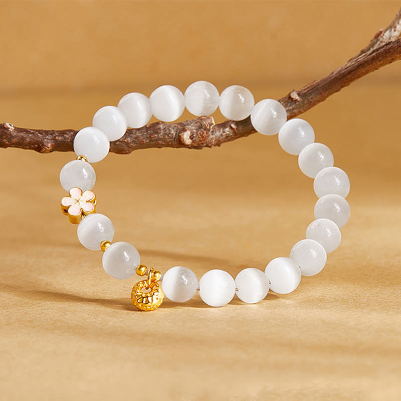 Pulsera con Buddha Stones en plata de ley 925 con ojo de gato blanco y flor de melocotón natural