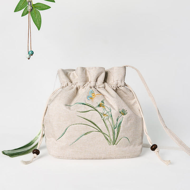 Bolso bandolera de lino y algodón con orquídea beige bordada con Buddha Stones