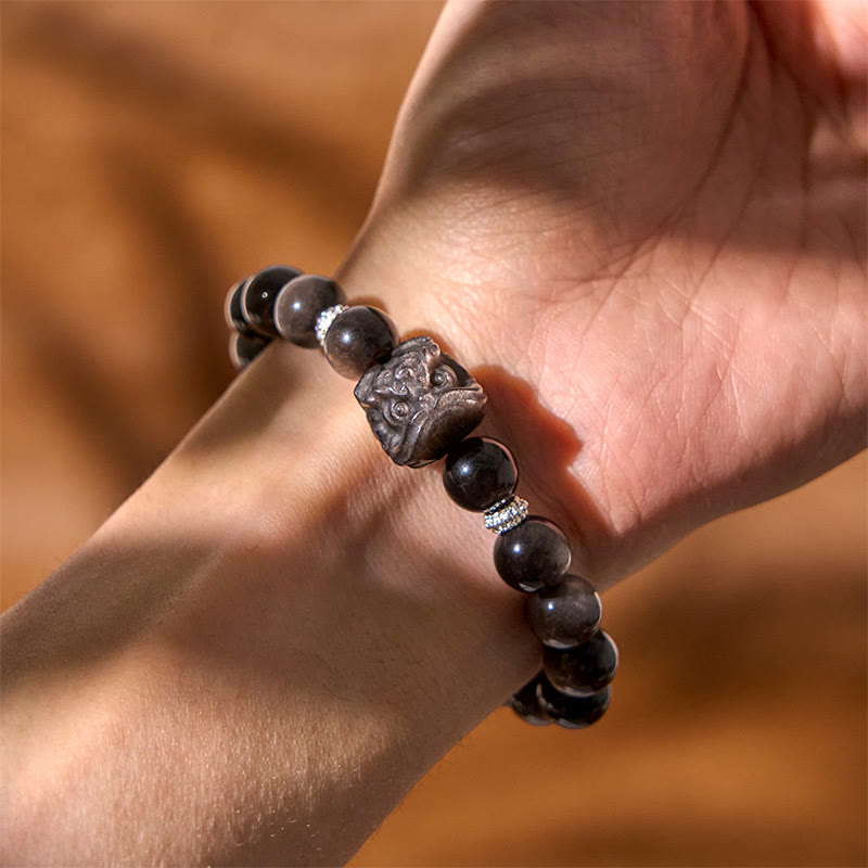 Pulsera protectora de obsidiana con brillo de plata natural y Buddha Stones para danza del león