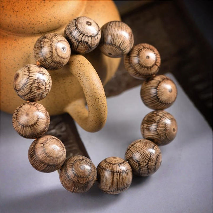 Pulsera protectora de cuentas de madera de gnetum con Buddha Stones - image 9