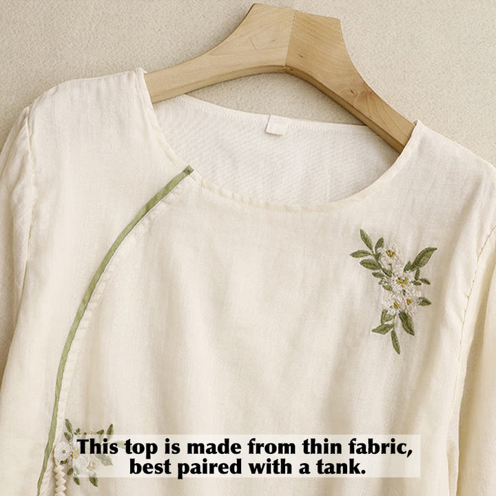 Camisa de mujer de manga tres cuartos con cuello redondo y bordado floral verde y Buddha Stones en color beige. - image 2