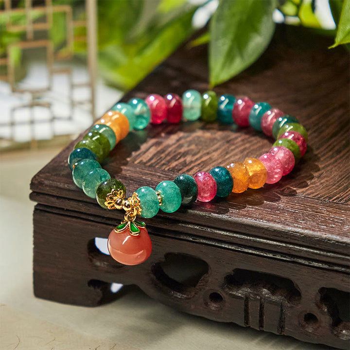 Pulsera positiva de melocotón con Buddha Stones