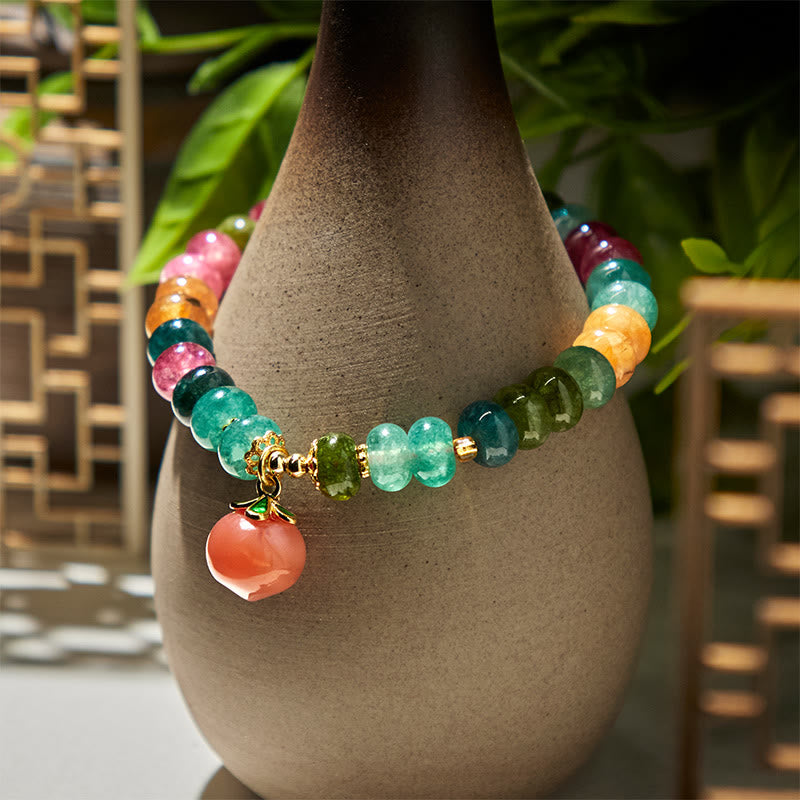 Pulsera positiva de melocotón con Buddha Stones