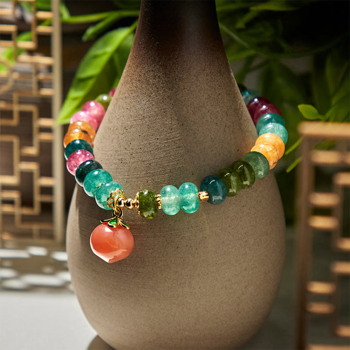 Pulsera positiva de melocotón con Buddha Stones