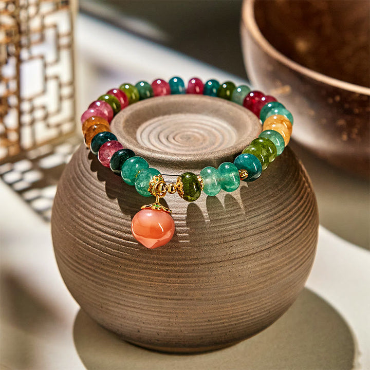 Pulsera positiva de melocotón con Buddha Stones